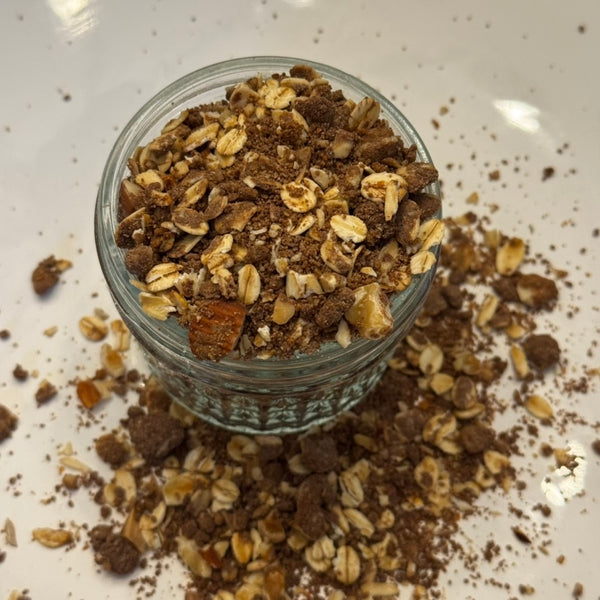 Bowl of Burlyman Chocolate Protein Granola with real cocoa and grass-fed whey