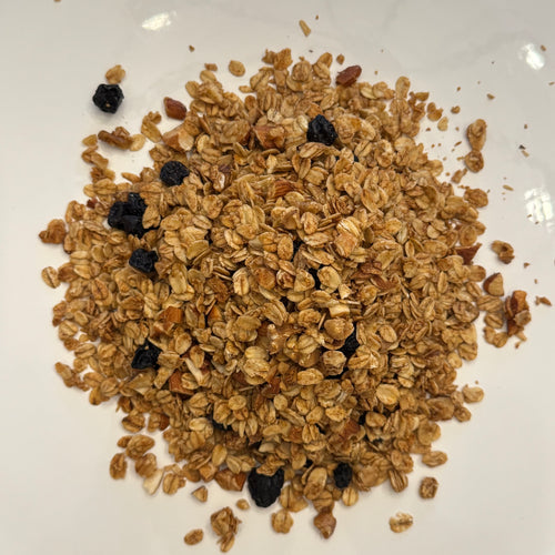 Burlyman Original Recipe Granola close-up showing oat clusters and dried blueberries